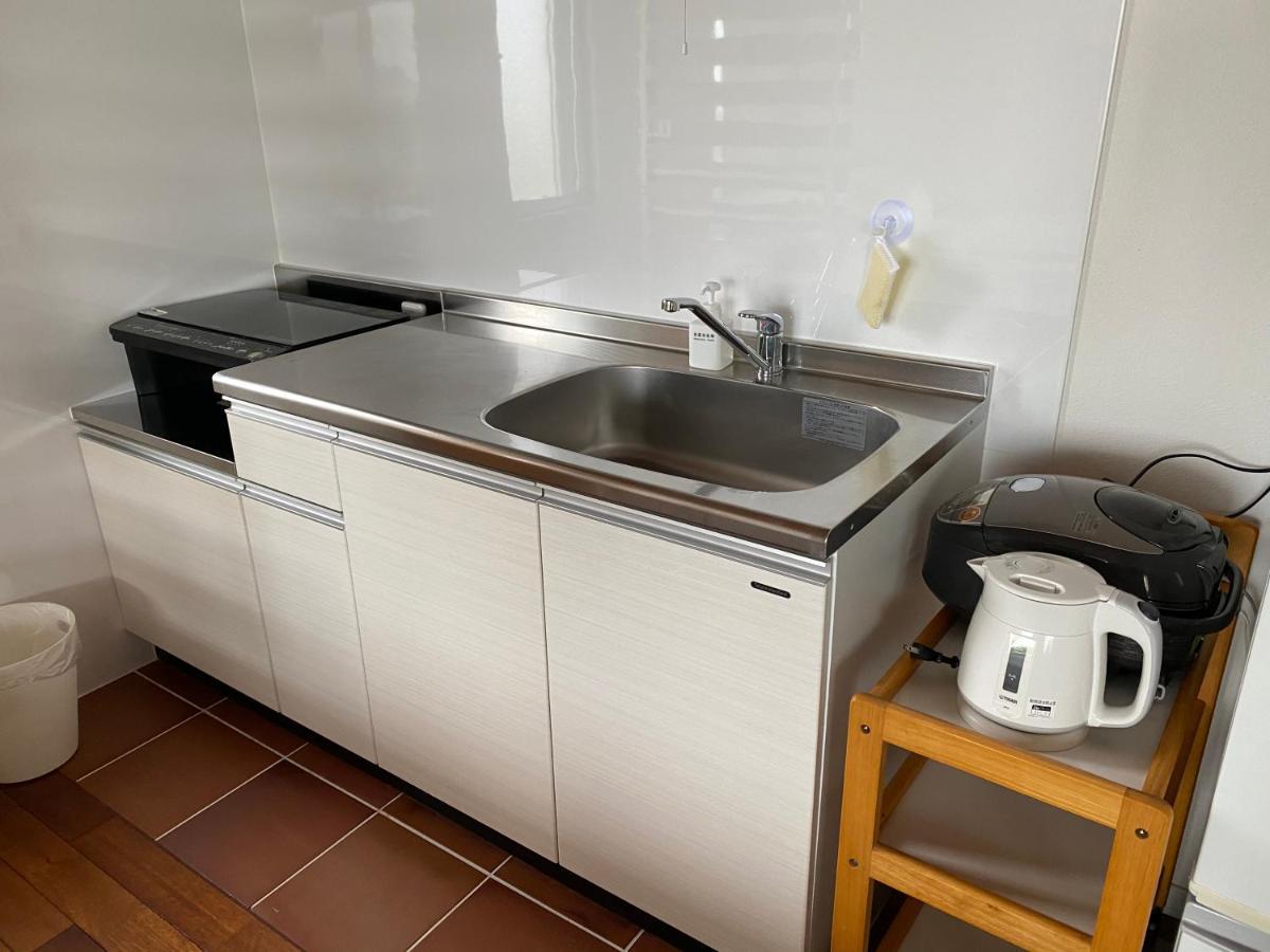 Ocean Front Sumuide Apartment Nago Exterior photo