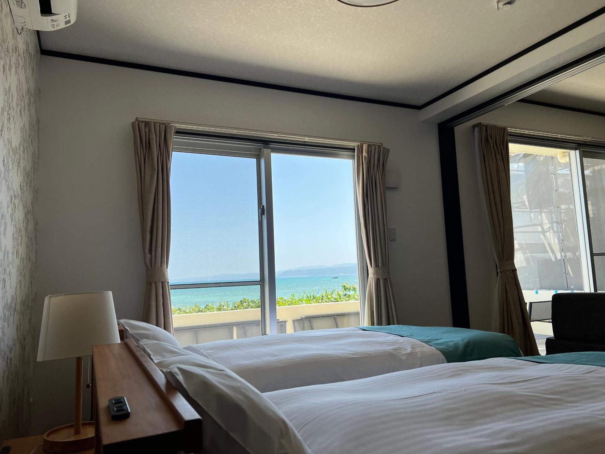 Ocean Front Sumuide Apartment Nago Exterior photo